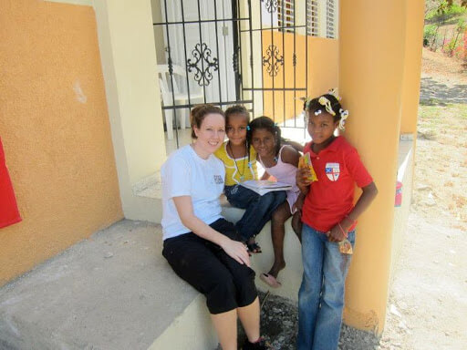 Team member Kate Pontello with local children on the steps of the unfinished high school in El Carreton, January 2012.